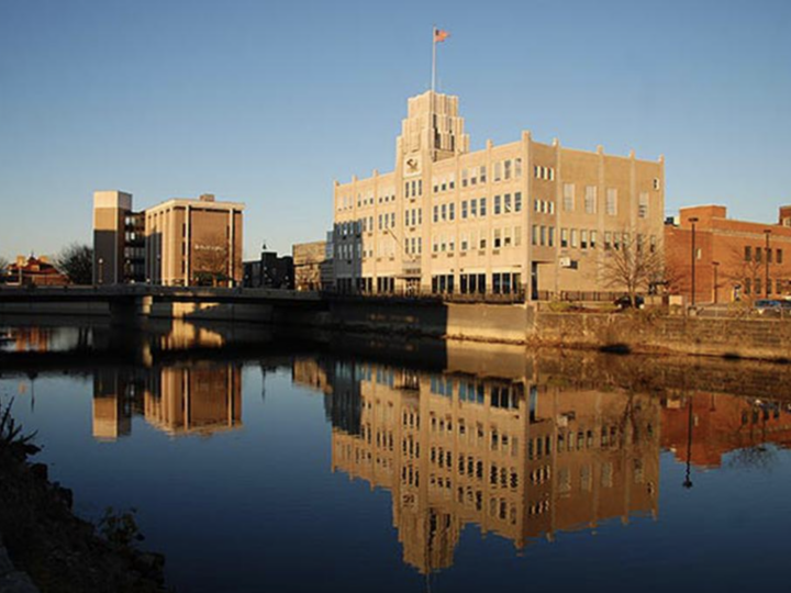 Sharon City Hall reflected in the water